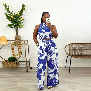 Stylish two-piece women's set featuring sleeveless top and floral print wide-leg pants