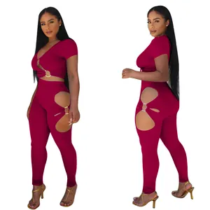 Detailed view of women's two-piece set with V-neck top and ring-cut leggings