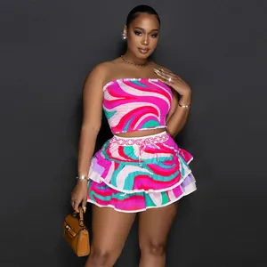 Vibrant abstract print two-piece set featuring strapless crop top and tiered mini skirt