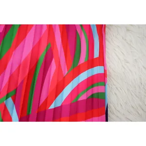 Macro detail of vibrant multi-colored abstract print on pleated plissé fabric