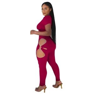 Side view of burgundy two-piece set featuring stylish hip cut-outs with ring detail