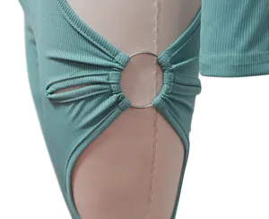 Close-up of metal ring cutout detail on a sage green ribbed fashion set for women.