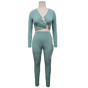 Detailed view of ribbed V-neck crop top and leggings set with cutout ring design
