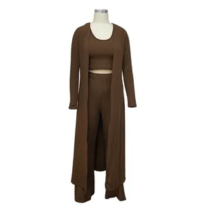 Detailed view of brown 3-piece ribbed set with crop top, pants, and long cardigan