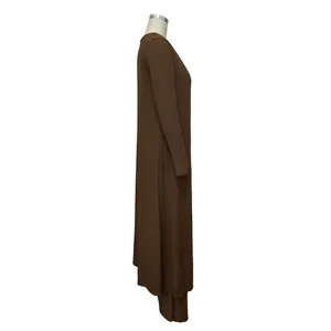 Side profile of women's brown high-stretch ribbed knit three-piece set with long cardigan