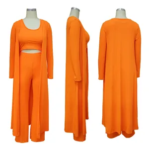 Front, side, and back view of orange three-piece ribbed knit set with cardigan