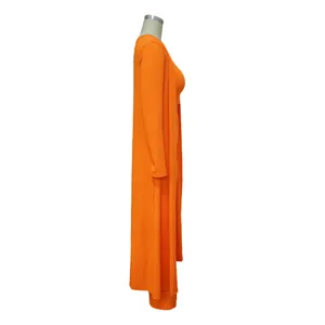 Side view of orange ribbed three-piece set showing long cardigan and pants texture