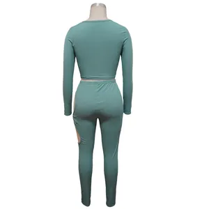 Back view detail of a teal rib-knit two-piece set featuring high-elastic cutout leggings