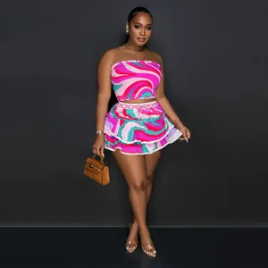 Sexy two-piece set with vibrant swirl print tube top and ruffled mini skirt