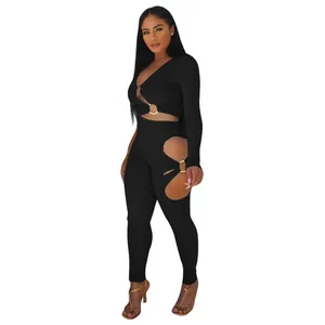 Sexy black ribbed two-piece set featuring daring side cutouts and elegant gold rings.
