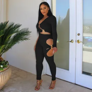 Full view of black ribbed two-piece set with sexy V-neck and cutout metal ring detail