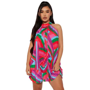 Detail of vibrant colorful geometric print pleated halter sleeveless beach mini dress