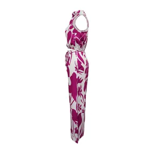 Side profile view of women's sleeveless floral print crop top and wide-leg trousers set