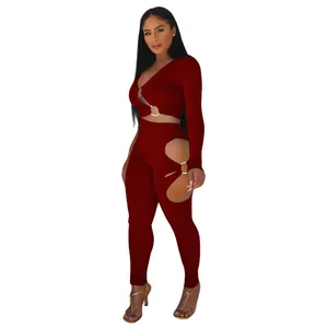 Detail of the burgundy ribbed long sleeve crop top and cutout leggings two piece set