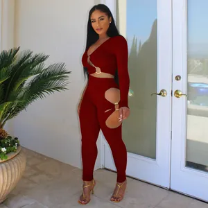 Sexy burgundy ribbed two-piece set with V-neck top and cutout leggings.