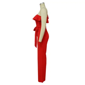 Side profile of elegant red off-the-shoulder ruffle jumpsuit with waist belt on mannequin