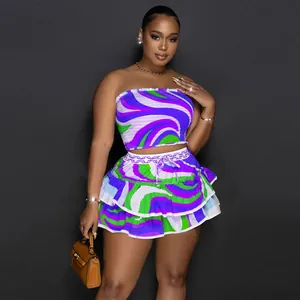 Fashionable women's two-piece set featuring swirl print crop top and ruffled mini skirt.