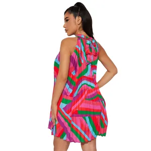 Detailed back view of a vibrant geometric pleated halter mini dress with a bow