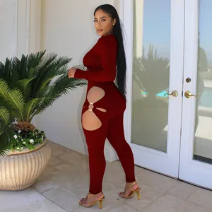 Sexy maroon ribbed knit jumpsuit featuring side hip cut-out with metal ring detail