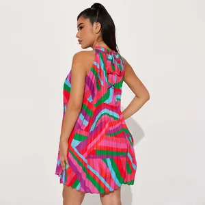 Detailed back view of a pleated sleeveless halter dress featuring vibrant geometric prints.