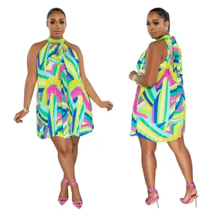 Front and back view of a colorful printed pleated halter mini dress for summer.