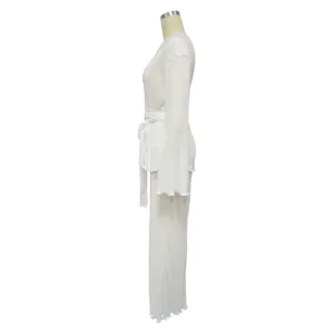 Detailed side view of white pleated long sleeve top and matching pants loungewear set