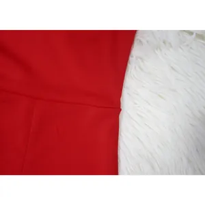 Detailed close-up showing the smooth red fabric and precise seam of a jumpsuit