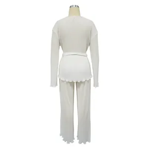 Back view of elegant white pleated long sleeve casual two-piece outfit for women