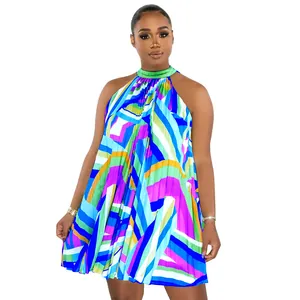 Detailed view of the vibrant geometric print and pleats on this halter mini dress