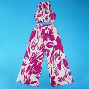 Two-piece vibrant floral print set with a sleeveless crop top and wide-leg trousers