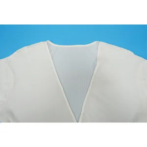 Detail view of the V-neckline on white pleated fabric for casual plus size women's top