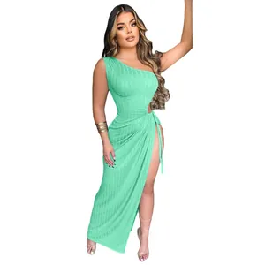 Detail view of a sexy mint green one-shoulder ribbed maxi dress with high slit