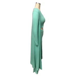 Side profile view of a mint green ribbed three-piece cardigan, top, and pants set