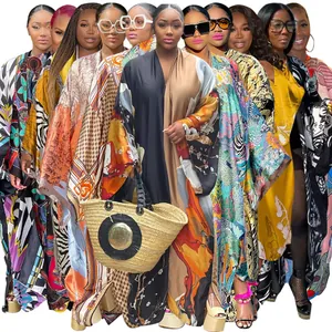 Detail view of various colorful printed loose long-sleeved kimono cardigans for women