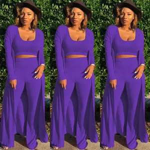 Sexy purple ribbed three-piece outfit with crop top, flared pants, and long duster