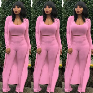Stylish pink ribbed three-piece set with crop top, wide-leg pants and long cardigan
