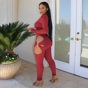 Sexy burgundy ribbed long sleeve jumpsuit with side cut-out and ring detail