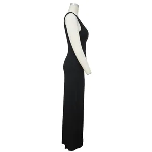 Side profile view of a sexy black ribbed one-shoulder maxi dress with a slim fit cut