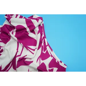 Close-up of the magenta and white floral pattern on the sleeveless fashion top detail.