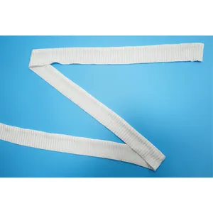 Detailed macro view showing the white crinkled fabric texture of a plus size fashion top