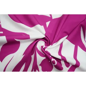 Macro detail of the vibrant pink and white floral pattern fabric for women's pant set