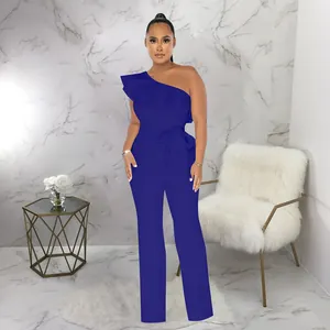 Elegant royal blue one-shoulder jumpsuit featuring ruffled detail and matching waist belt.
