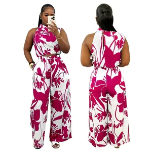 Elegant two-piece sleeveless crop top and wide-leg floral print pants set with pockets