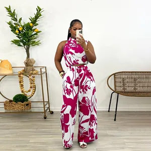 Full length view of a two-piece sleeveless floral print top and wide-leg trousers
