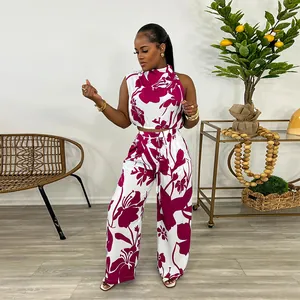 Detailed view of women's stylish two-piece set with vibrant magenta floral print