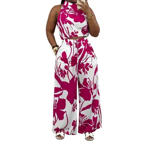 Full view of women's magenta floral print sleeveless halter top and wide leg pants set