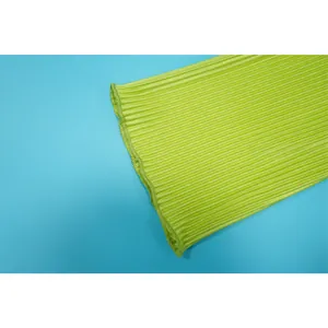 Detailed close-up view of vibrant green pleated fabric with fine vertical texture