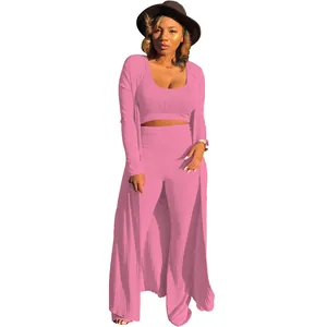 Close-up of pink three-piece ribbed set featuring crop top and long cardigan