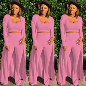 Pink high-stretch ribbed 3-piece set featuring crop top, wide-leg pants, and cardigan