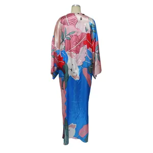 Detailed back view of a women's loose casual kimono with colorful tropical print